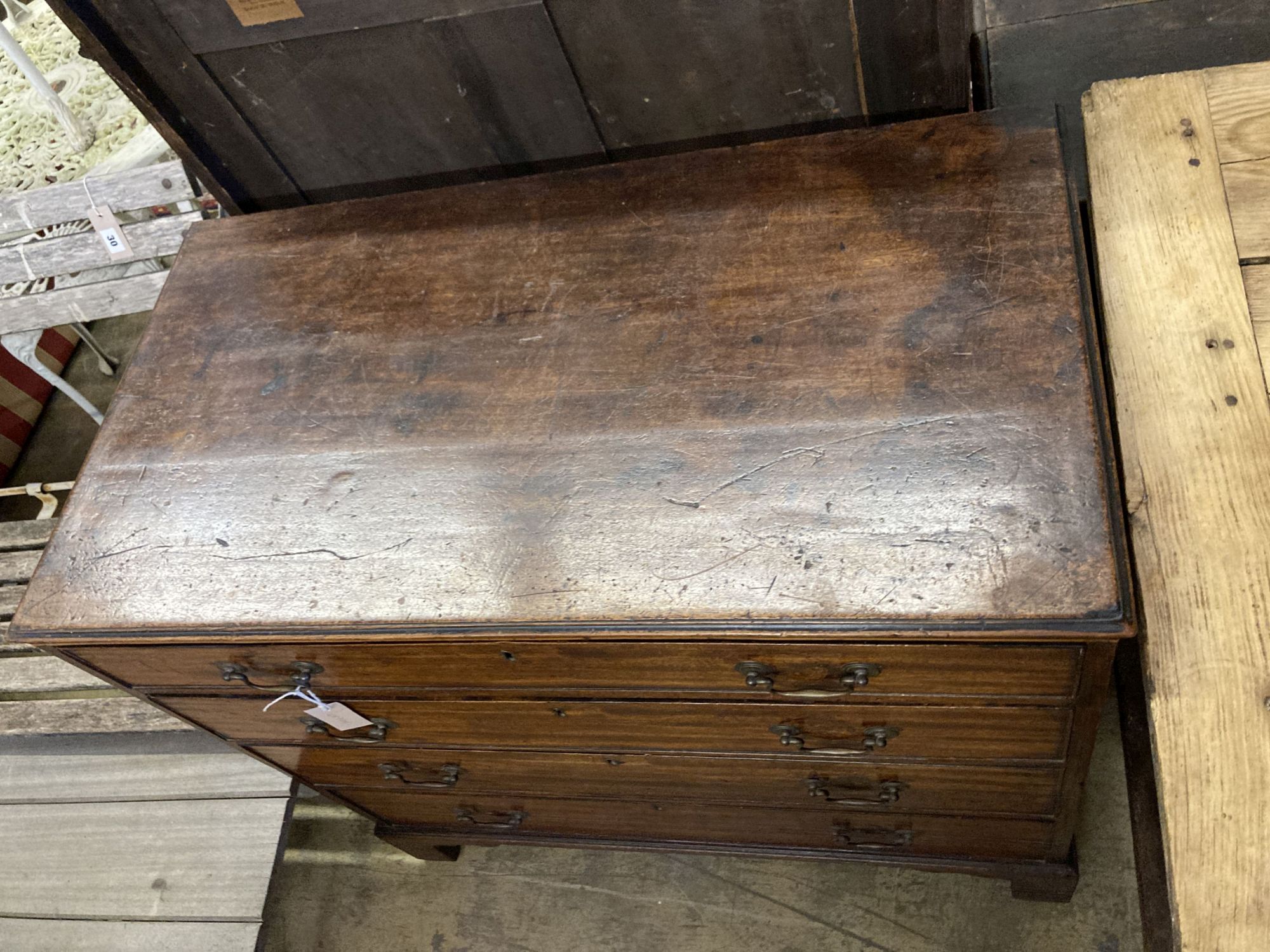 A late George III mahogany straight front chest, of four long graduated drawers, width 93cm, depth 50cm, height 86cm